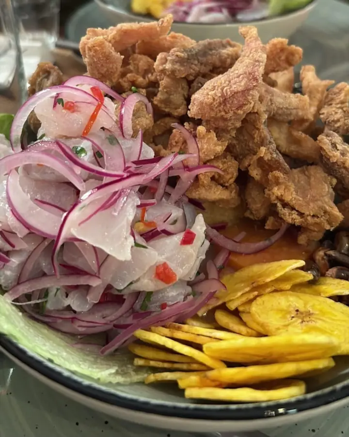 Ceviche carretillero with red onion, chicharrón de pescado and plantain chips