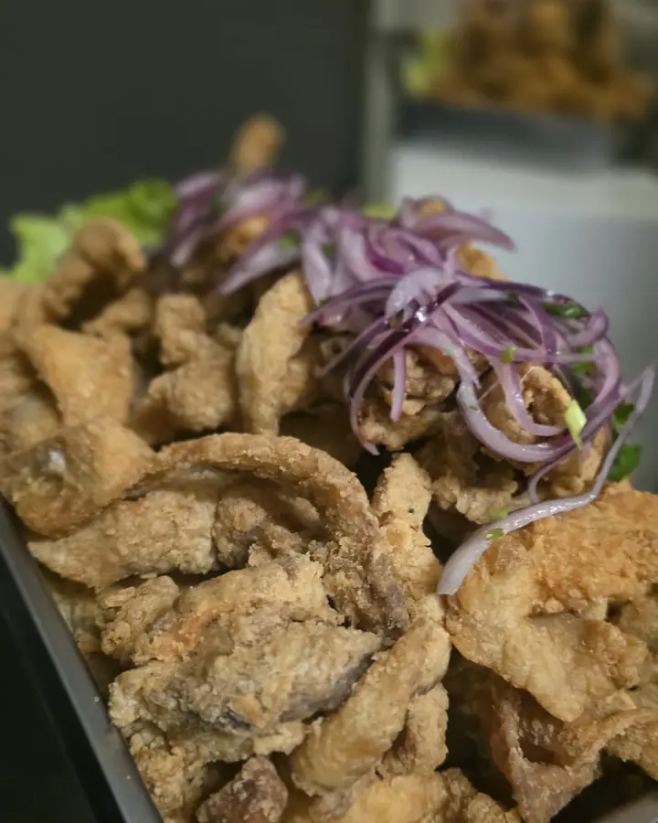 Tray of freshly fried chicharrón de pescado in our kitchen