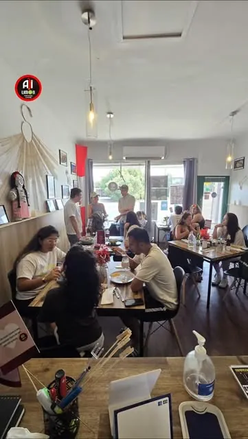 Guests eating lunch in the bright dining room of Ají & Limón