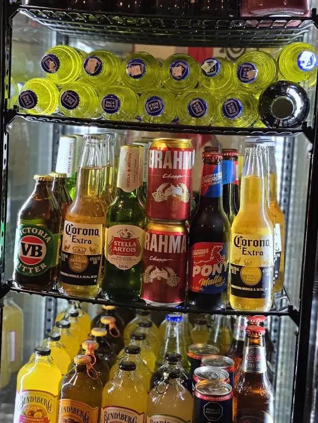 Fridge stocked with Peruvian and Latin American beers and soft drinks