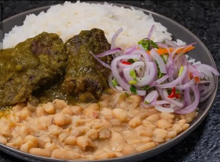 Seco con frejoles: coriander beef stew with beans, rice and salsa criolla